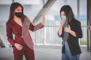 Woman worry and fear Female friend  cough  in medical mask outdoor. keep distance. Stop corona virus
