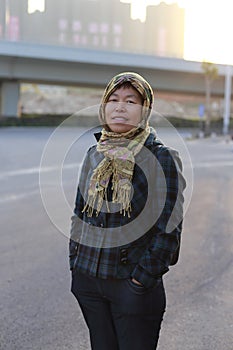 Woman wrap head with a scarf