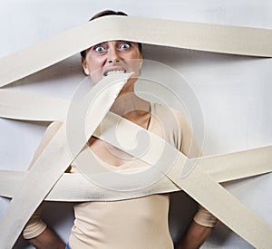 Woman wrapped in bandages