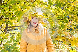 Woman with a wreath of autumn leaves on her head