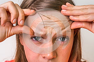 Woman with wrinkles on forehead photo