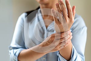 Woman wrist arm pain long working. office syndrome healthcare and medicine concept photo