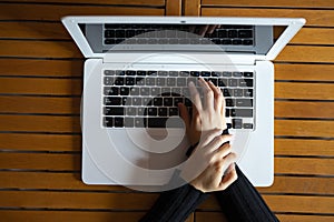 Woman with wrist pain from working with the computer photo