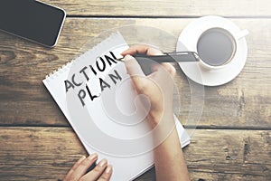 Woman write action plan text