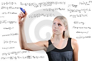woman writes mathematical equations
