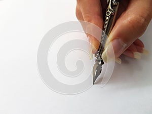 Woman writing with feather pen