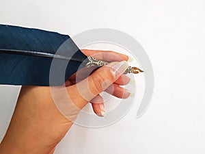 Woman writing with feather pen