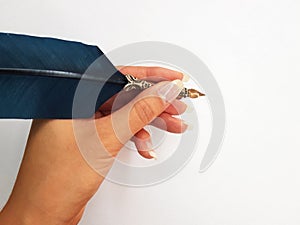 Woman writing with feather pen