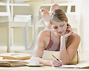 Woman Writing on Files