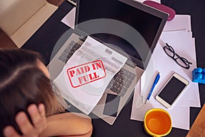 Woman writing home budget with calculator top view