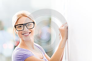 Woman writing ideas on adhesive notes