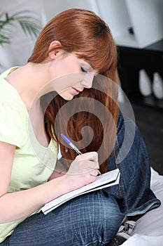 Woman writing in a notebook