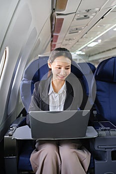 Woman Writing Notebook Plane Flying Concept