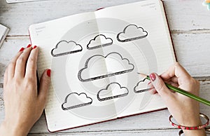 Woman writing on a notepad