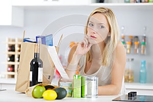 Woman writing shopping list