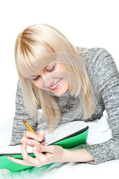 Woman writing and smiling