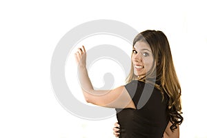 Woman writing on white board