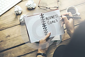 Woman written business goals text
