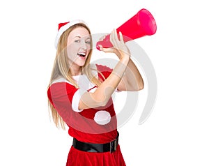 Woman with xmas dress yell with megaphone