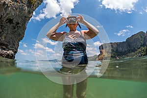 Woman in years going to immerse underwater