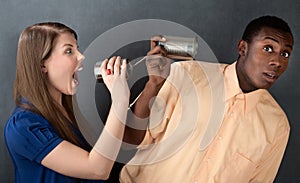 Woman Yelling at Man Through Stringed Cans