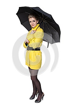 Woman in yellow coat, shoes and umbrella