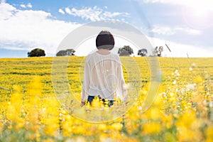 Woman in yellow field