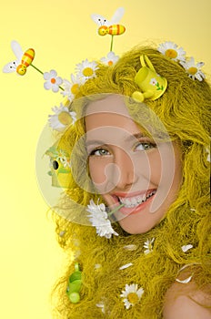 Woman with yellow hair, flowers, and bees in them