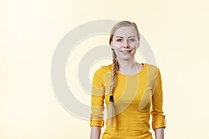 Woman in yellow having blonde braid hair