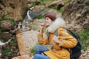 woman yellow jacket tourism mountains adventure landscape