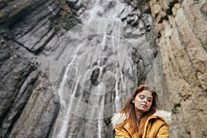 woman yellow jacket tourism mountains adventure landscape