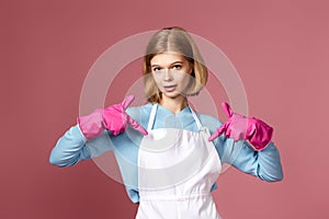 woman in yellow rubber gloves pointing oneself with fingers