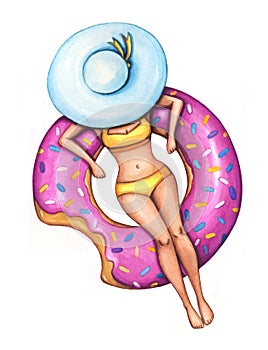 Woman in a yellow swimsuit swims on an inflatable pink donut float. photo