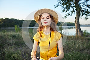 Woman in yellow t-shirt hat red lips photographer nature fresh air