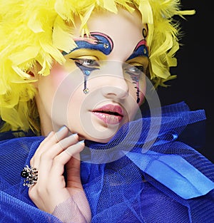 Woman with yellow wig feather