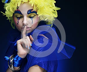 Woman with yellow wig feather