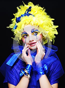 Woman with yellow wig feather