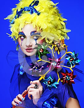 Woman with yellow wig feather