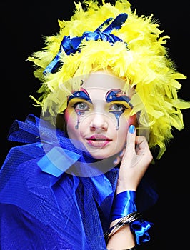 Woman with yellow wig feather