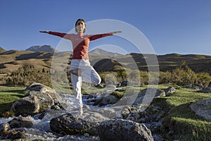 woman yoga and lotus silhouette pose meditation and relax in the mountain river. Healthy and Zen Concept Close up