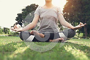 woman yoga and meditate in the lotus position at park