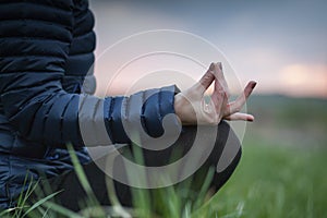 woman in a yoga pose at sunset - mindfulness, meditation, mental health