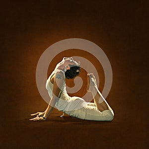 Woman in yoga position. Hamsa