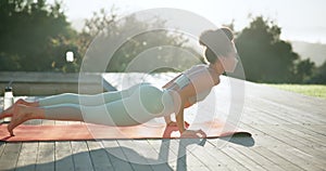 Woman, yoga and relax in nature for zen workout, exercise or outdoor body stretching in sun. Female person or yogi in