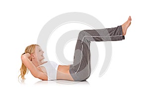 Woman, yoga and sit ups on floor in studio for exercise, healthy body or wellness with fitness, smile or flexibility