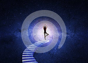 Woman yoga stairs to the universe