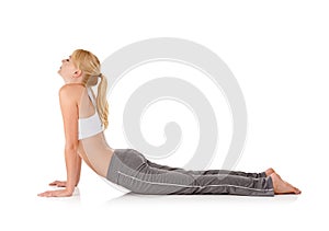 Woman, yoga and stretching on floor in studio for exercise, healthy body and wellness with fitness and mockup space