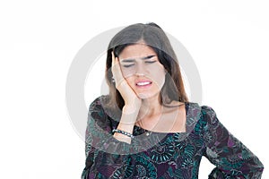 Woman young brunette in pain having headache hands on head