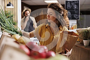 Client uses paper bag in supermarket photo