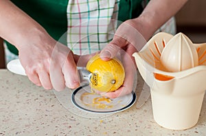 A Woman Zesting a Lemon